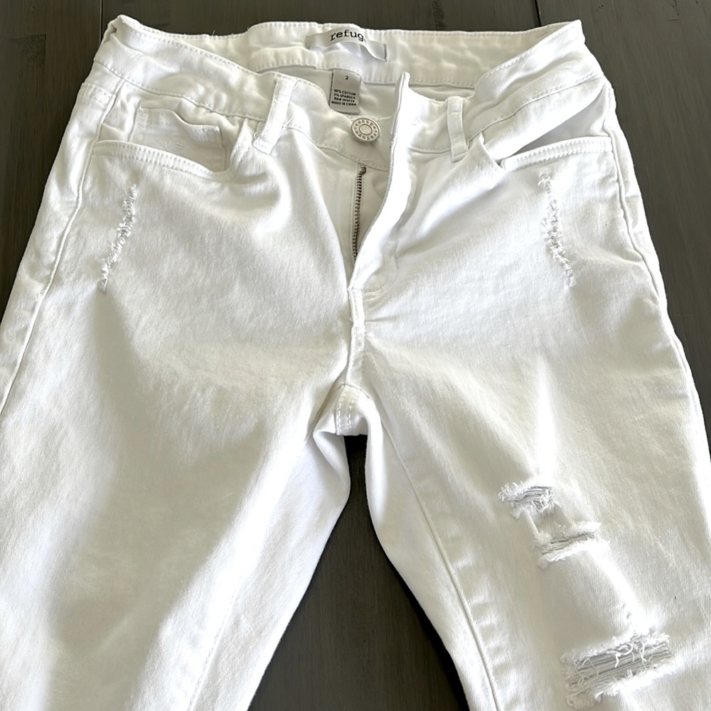 White jeans with holes. No stains. Worn twice.